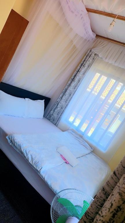 Rúm í herbergi á Joy apartment