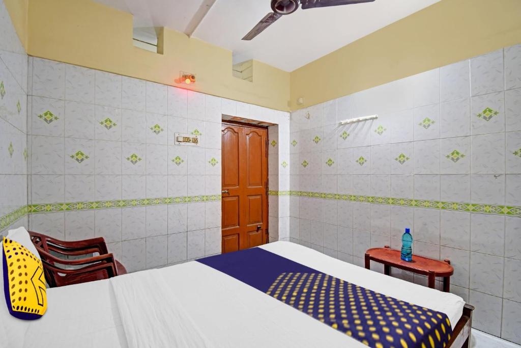 Postel nebo postele na pokoji v ubytování Hotel O Bikram Lodge