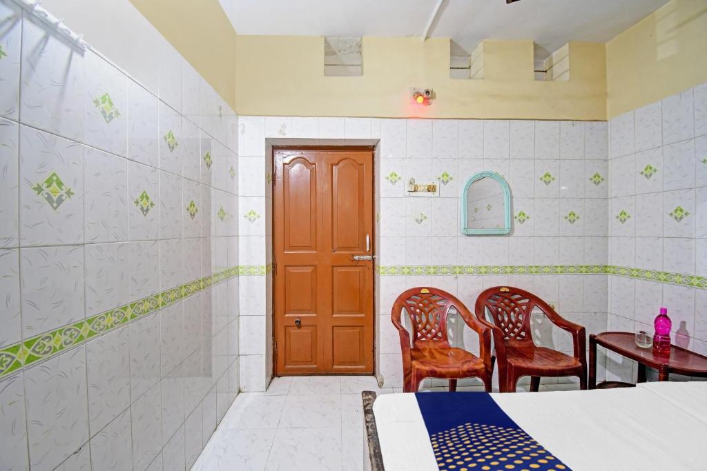 Postel nebo postele na pokoji v ubytování Hotel O Bikram Lodge