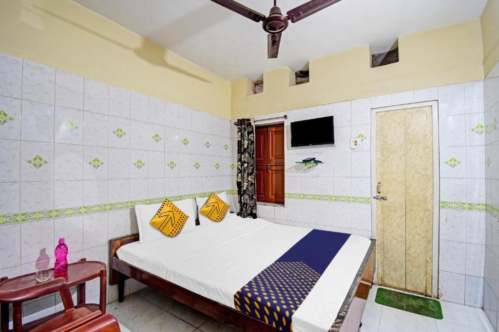 Postel nebo postele na pokoji v ubytování Hotel O Bikram Lodge