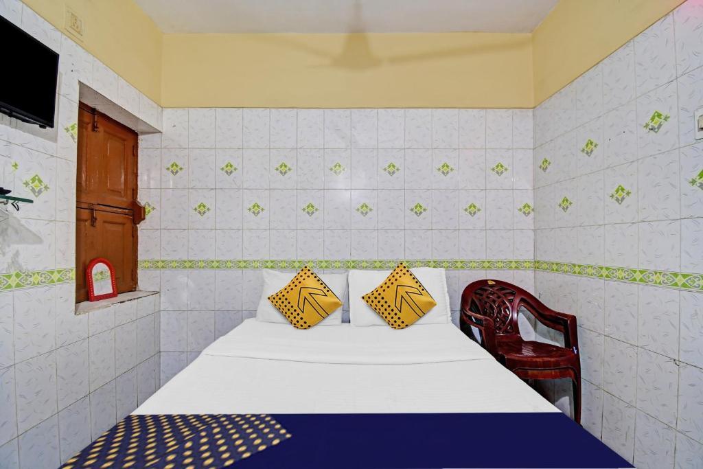 Postel nebo postele na pokoji v ubytování Hotel O Bikram Lodge