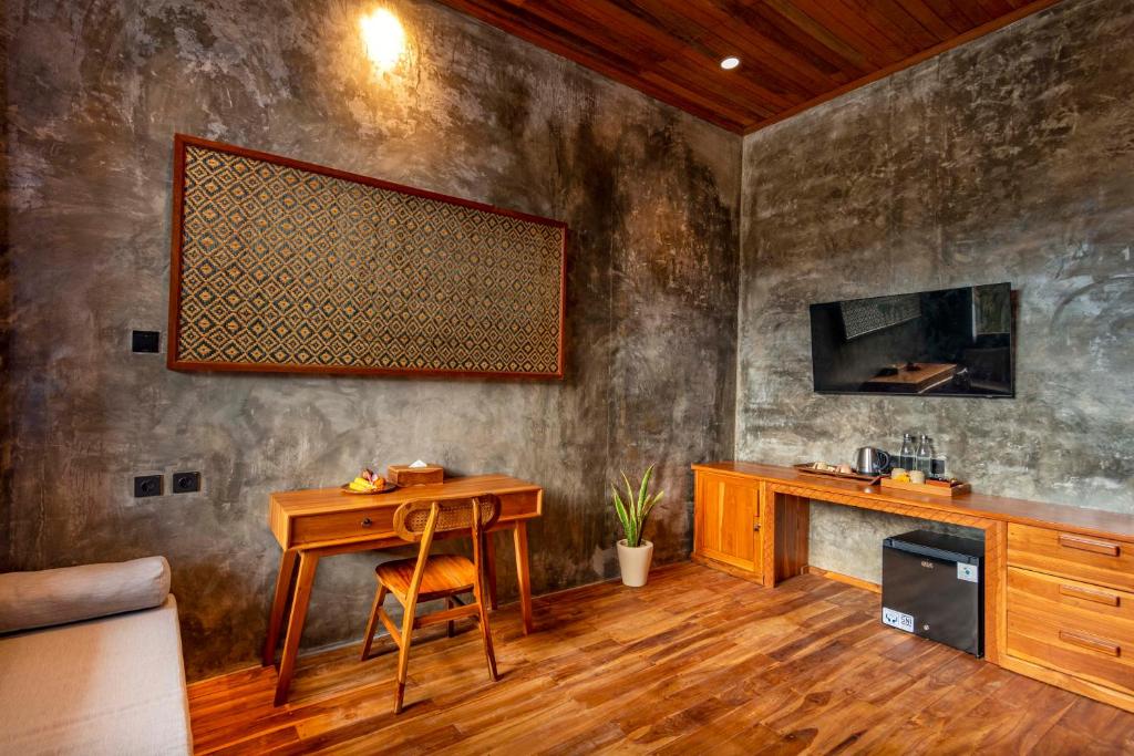 TV a/nebo společenská místnost v ubytování The Lumbung Jaya Resort