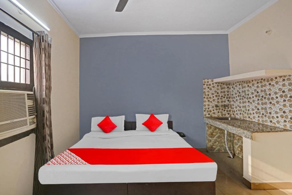 Postel nebo postele na pokoji v ubytování Hotel O Dremland Residency