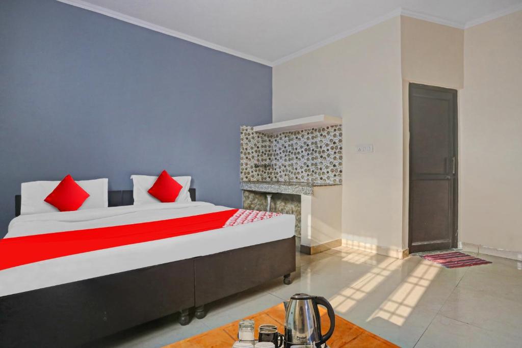 Postel nebo postele na pokoji v ubytování Hotel O Dremland Residency