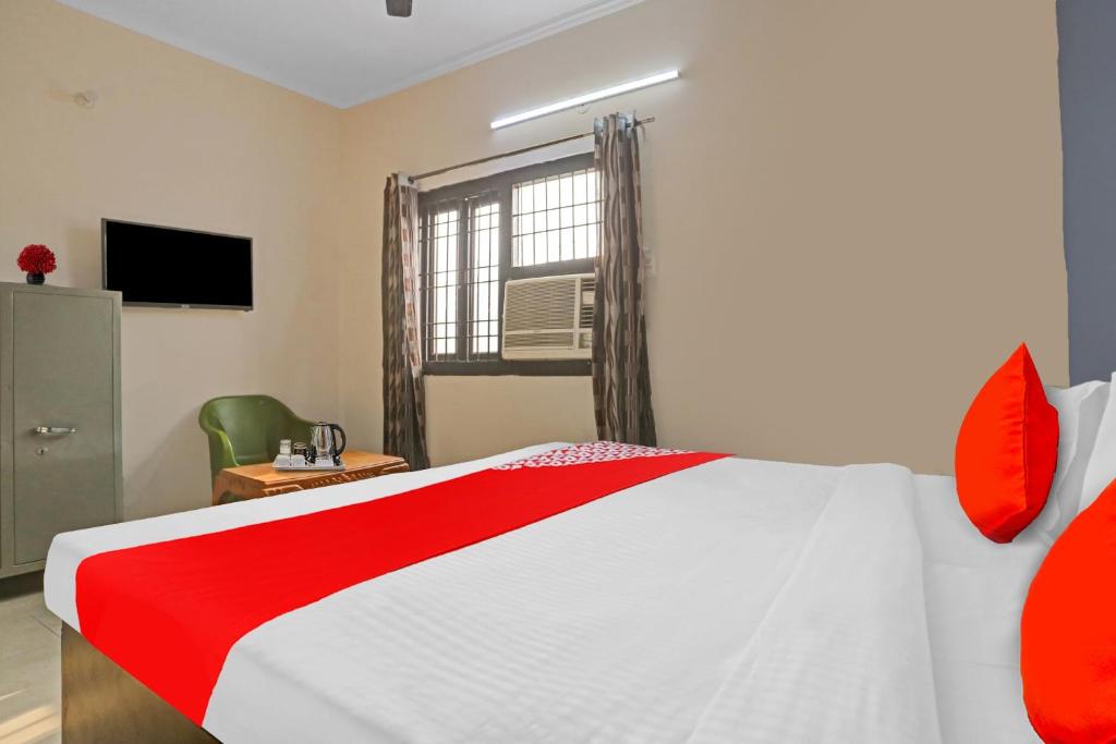 Postel nebo postele na pokoji v ubytování Hotel O Dremland Residency