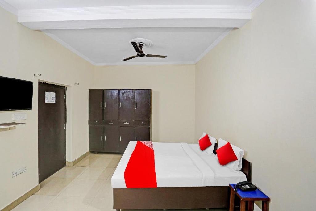 Postel nebo postele na pokoji v ubytování Hotel O Dremland Residency