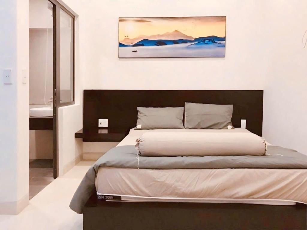 Giường trong phòng chung tại Q.HI homestay