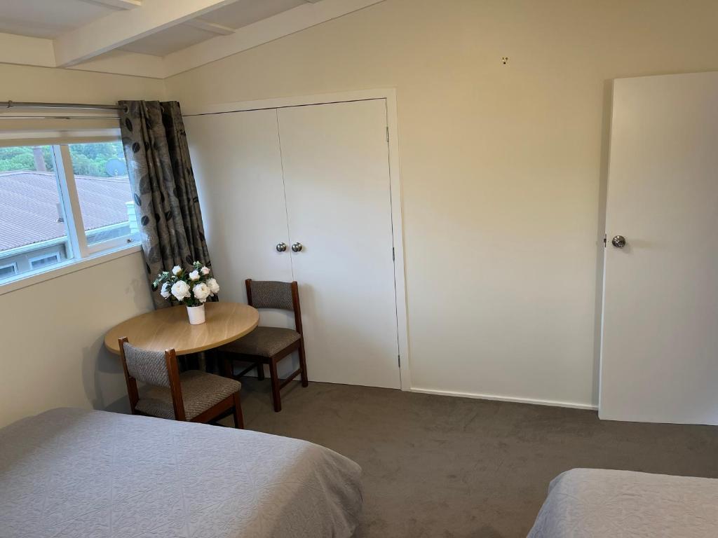 Postel nebo postele na pokoji v ubytování Hillcrest Homestay