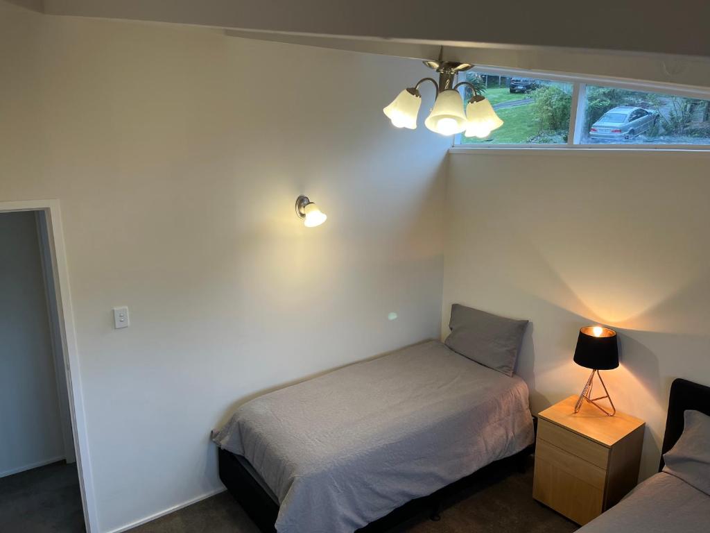 Postel nebo postele na pokoji v ubytování Hillcrest Homestay