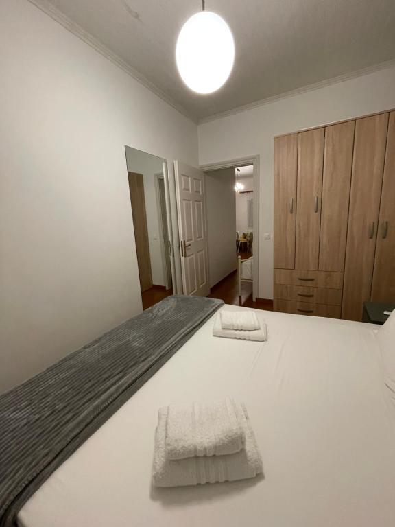 Łóżko lub łóżka w pokoju w obiekcie Ionian Grand - Apartments