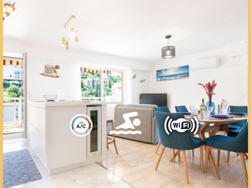 une cuisine et un salon avec une table et des chaises dans l'établissement Appart 4 étoiles, piscine, parking, wifi, à Saint-Raphaël