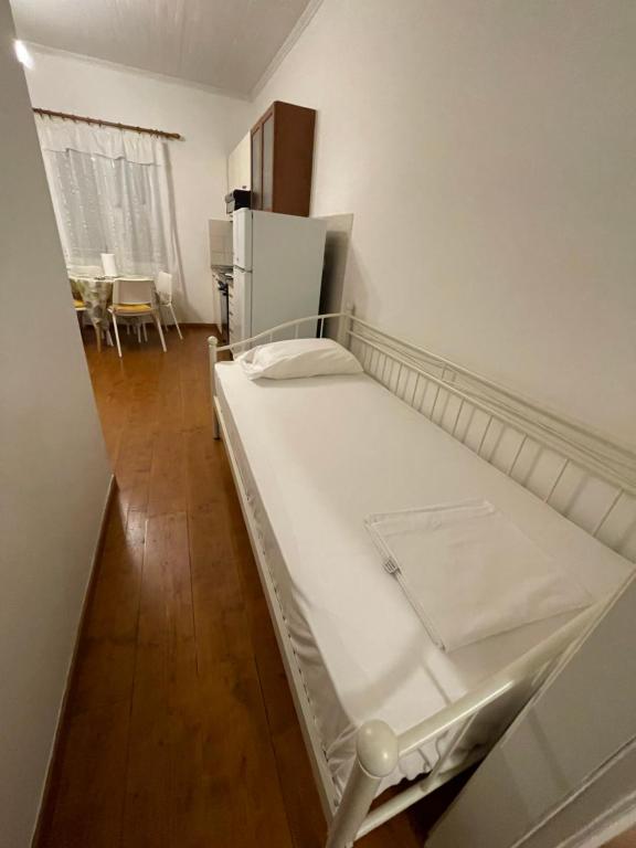 Łóżko lub łóżka w pokoju w obiekcie Ionian Grand - Apartments
