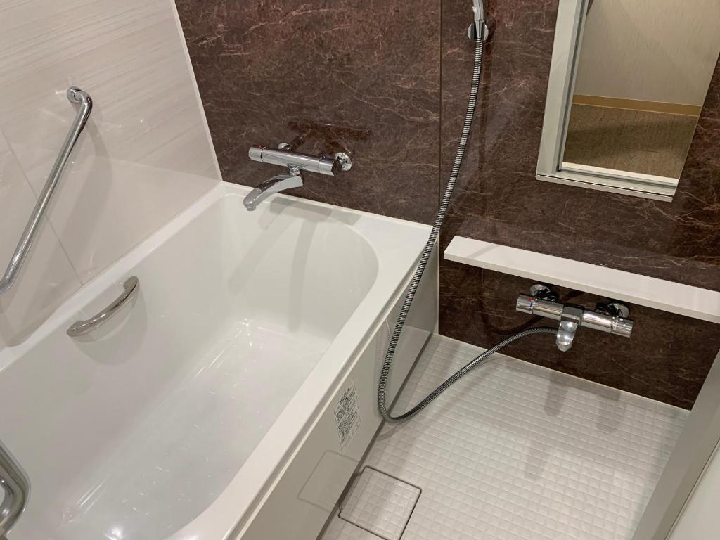 Koupelna v ubytování HOTEL BRILLIO ASAKUSABASHI