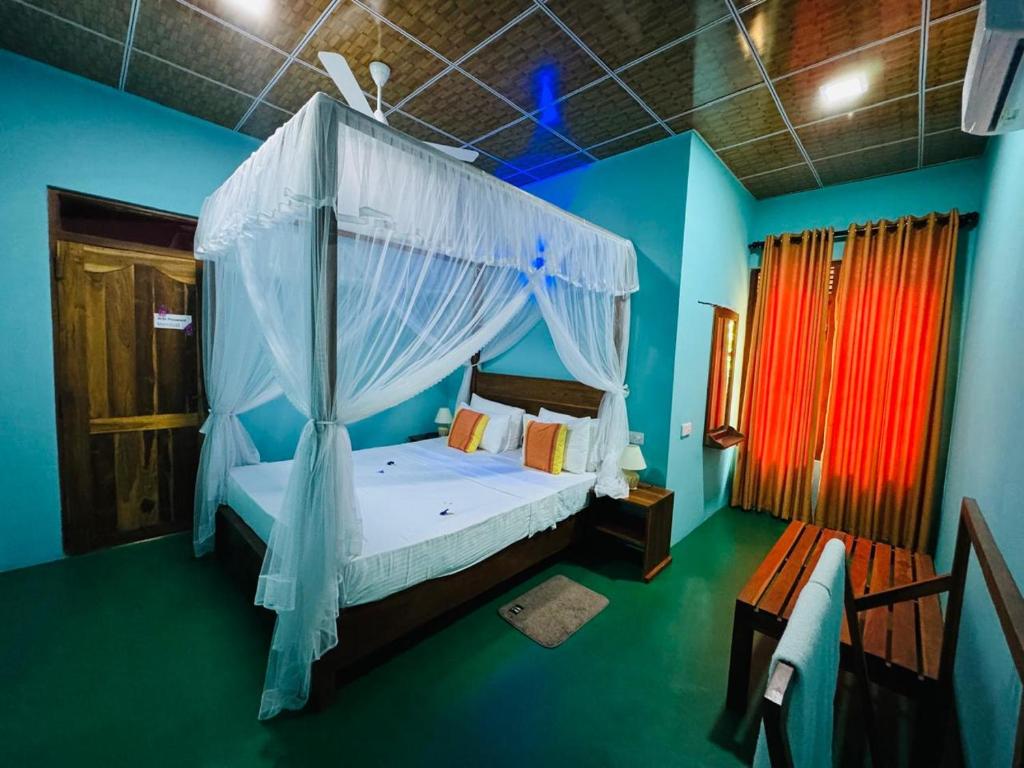 Postel nebo postele na pokoji v ubytování Sigiri Siesta Homestay