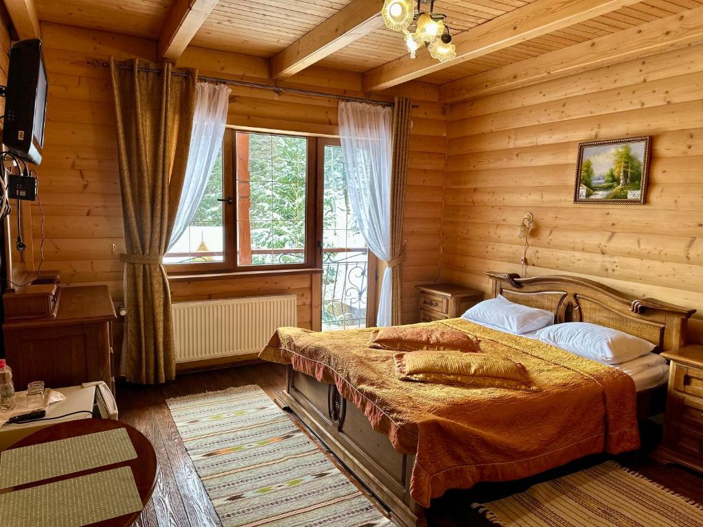 Ένα ή περισσότερα κρεβάτια σε δωμάτιο στο Hotel Dykyi Med