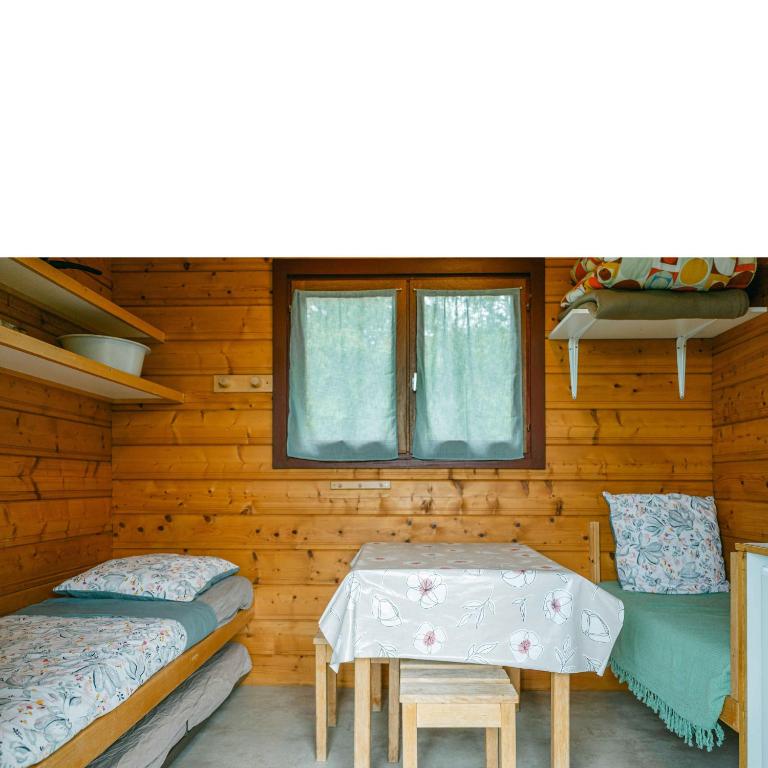Postel nebo postele na pokoji v ubytování Camping Sérendipité