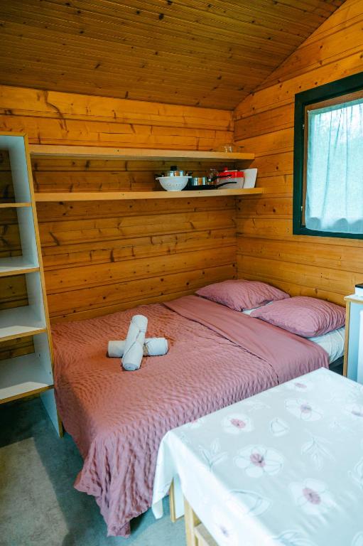 Postel nebo postele na pokoji v ubytování Camping Sérendipité