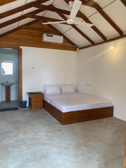 Postel nebo postele na pokoji v ubytování Bliss Cabana