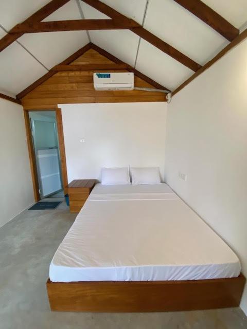 Postel nebo postele na pokoji v ubytování Bliss Cabana