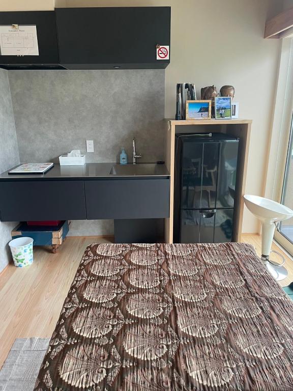 Postel nebo postele na pokoji v ubytování Sakura house
