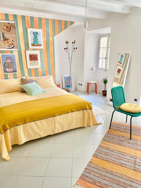 Postel nebo postele na pokoji v ubytování Casa Curiè 17 in borgo storico