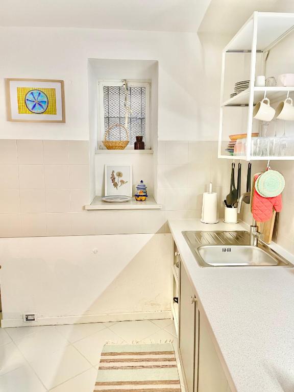Kuchyň nebo kuchyňský kout v ubytování Casa Curiè 17 in borgo storico