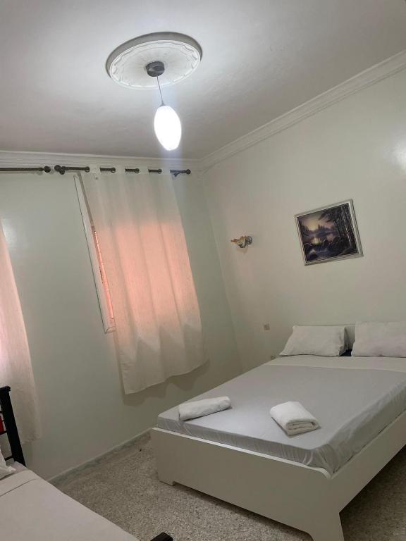 Postel nebo postele na pokoji v ubytování Hotel Maison Olga