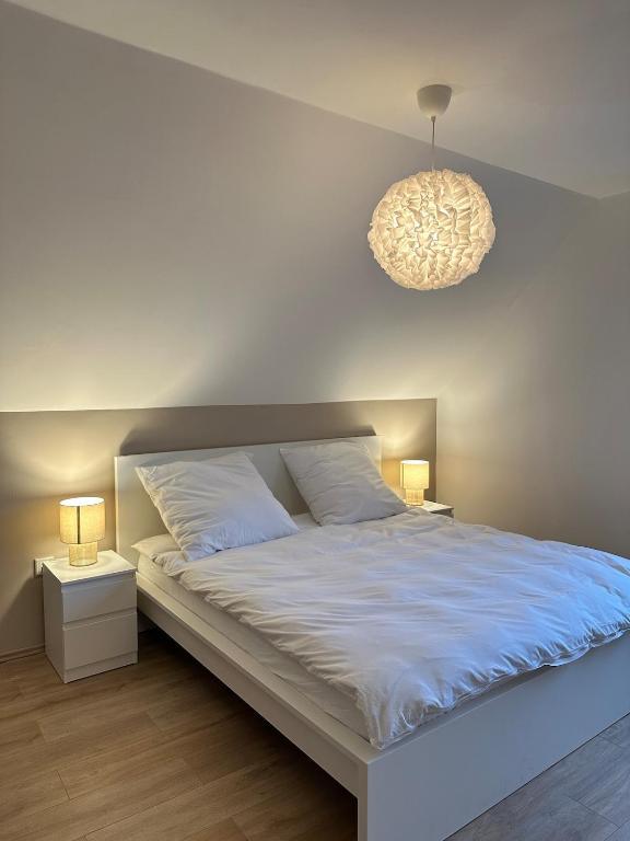 Postel nebo postele na pokoji v ubytování Moderne Ferienwohnung