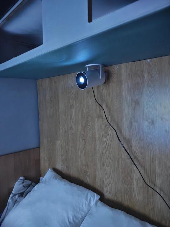 Postel nebo postele na pokoji v ubytování Le petit Logis