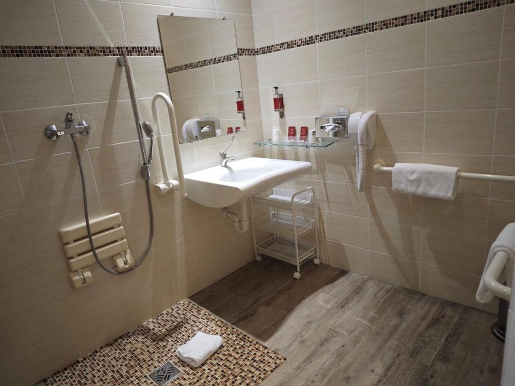 Koupelna v ubytování Hotel Capitole