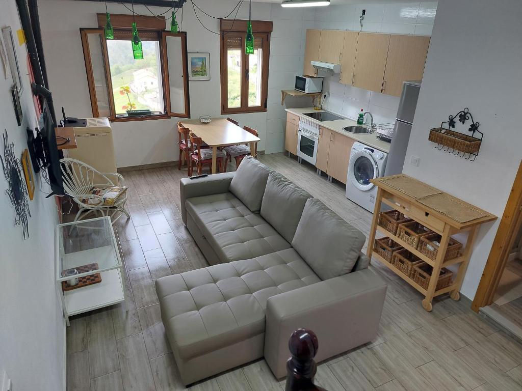 an overhead view of a living room with a couch at Casa Rural, paz y naturaleza. in Los Quintanales