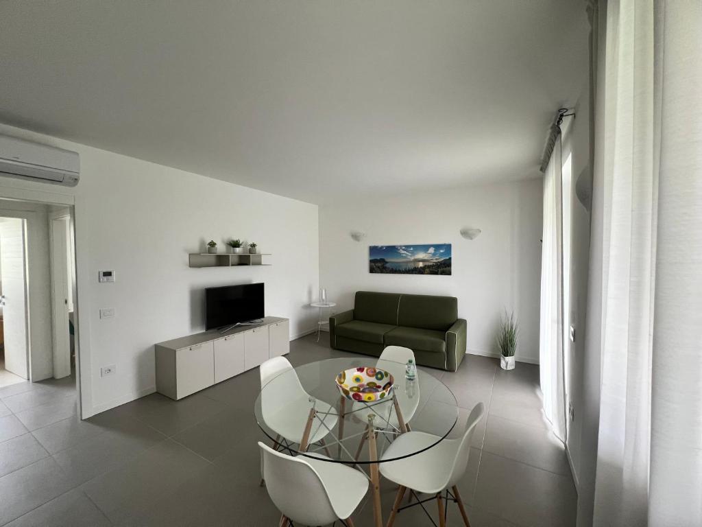 Televízia a/alebo spoločenská miestnosť v ubytovaní Val Mora Bio Apartments