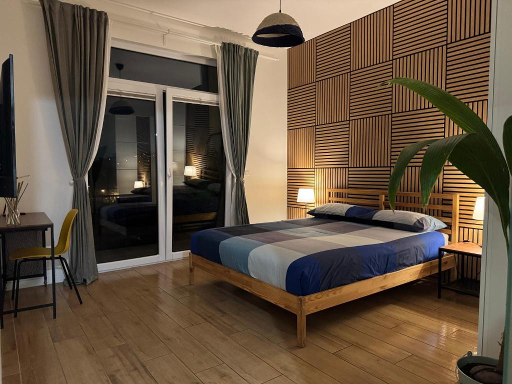 Postel nebo postele na pokoji v ubytování Occhi sul mare Apartment