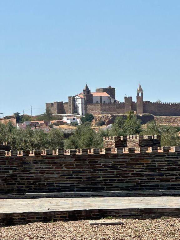 an amphitheater with a castle in the background at Casa da Aldeia in Moura