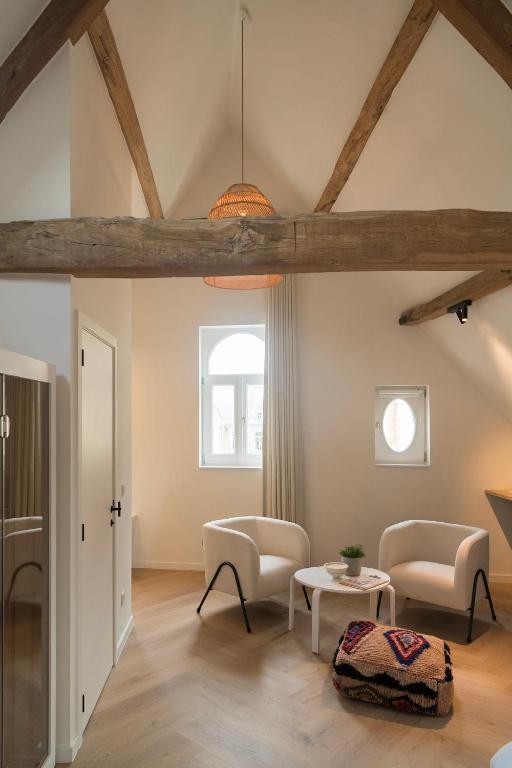 Posezení v ubytování NOX Logies, vakantiewoning en polyvalente ruimte
