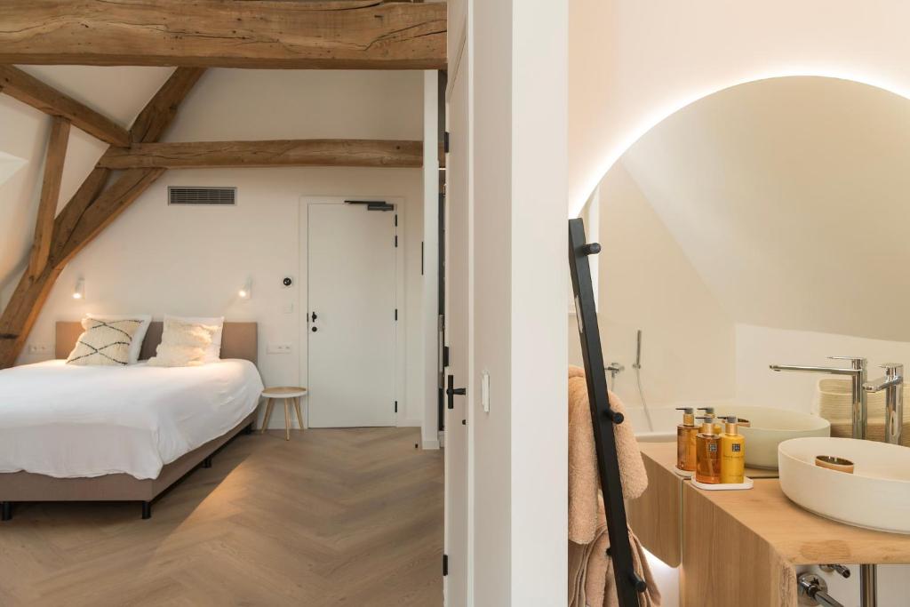 Postel nebo postele na pokoji v ubytování NOX Logies, vakantiewoning en polyvalente ruimte