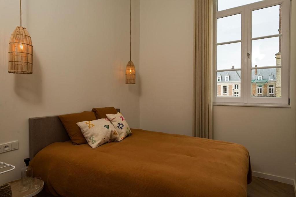 Postel nebo postele na pokoji v ubytování NOX Logies, vakantiewoning en polyvalente ruimte