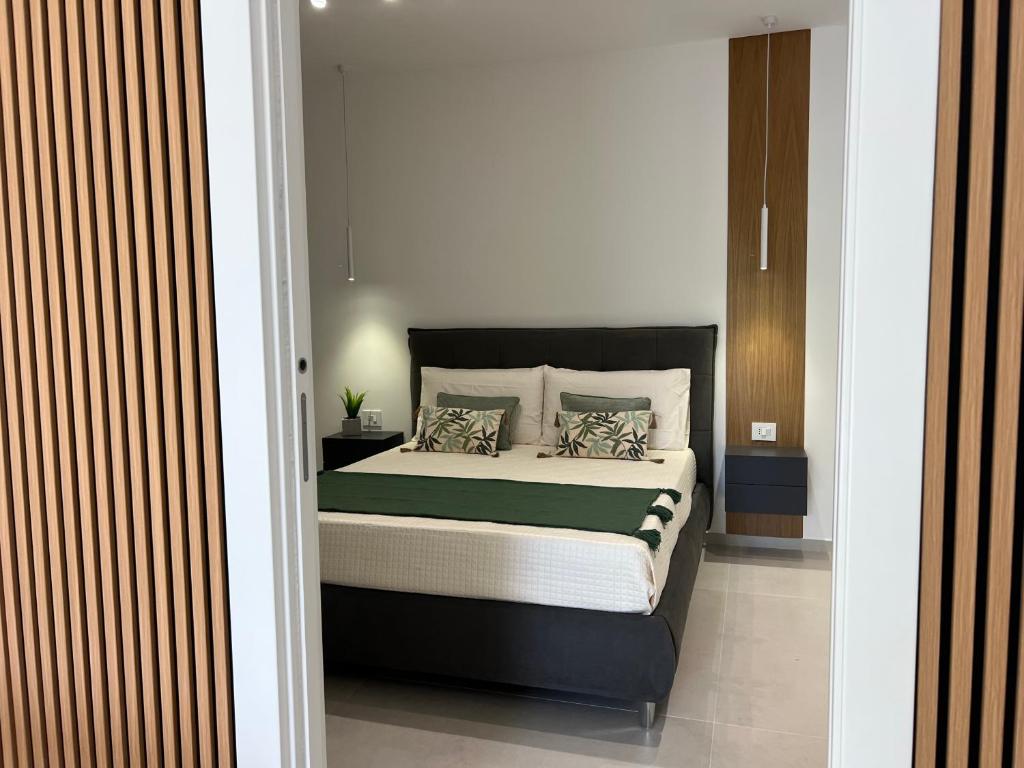 a bedroom with a large bed in a room at Palazzo Tilde in Marsala