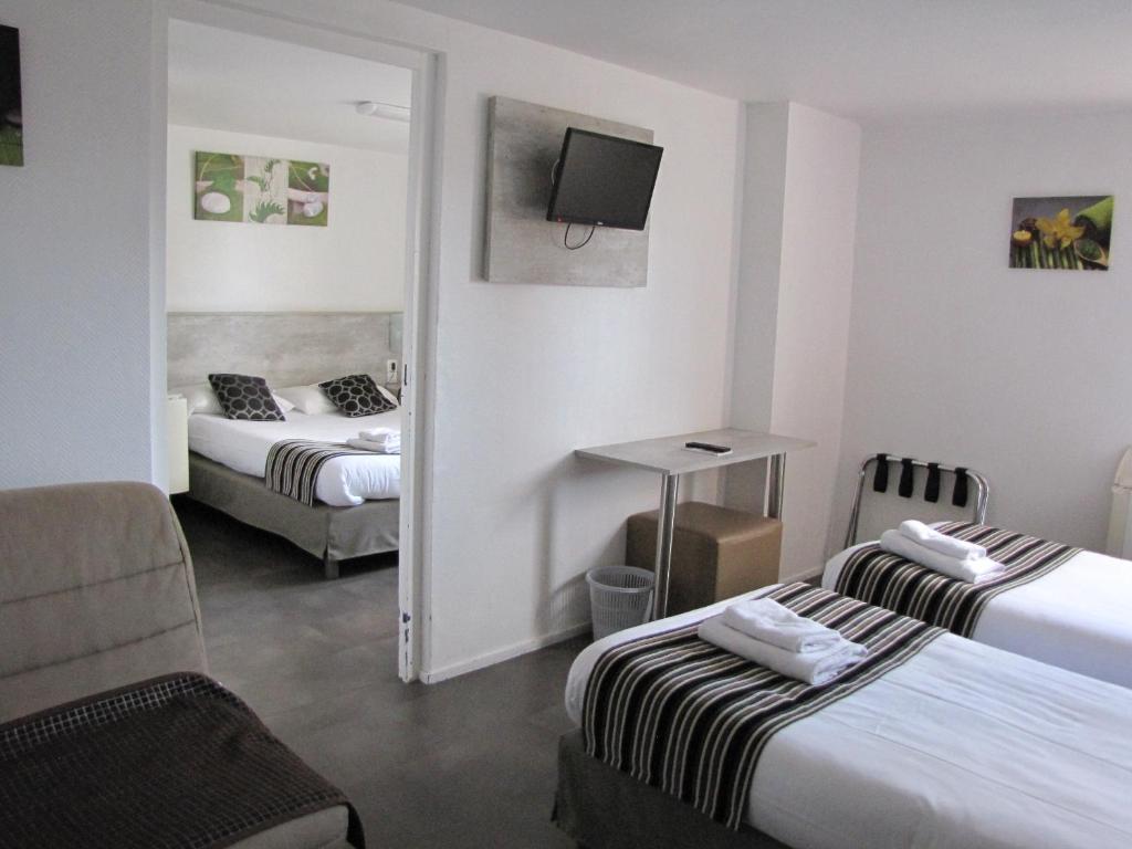 Postel nebo postele na pokoji v ubytování Brit Hotel Bosquet Carcassonne Cité
