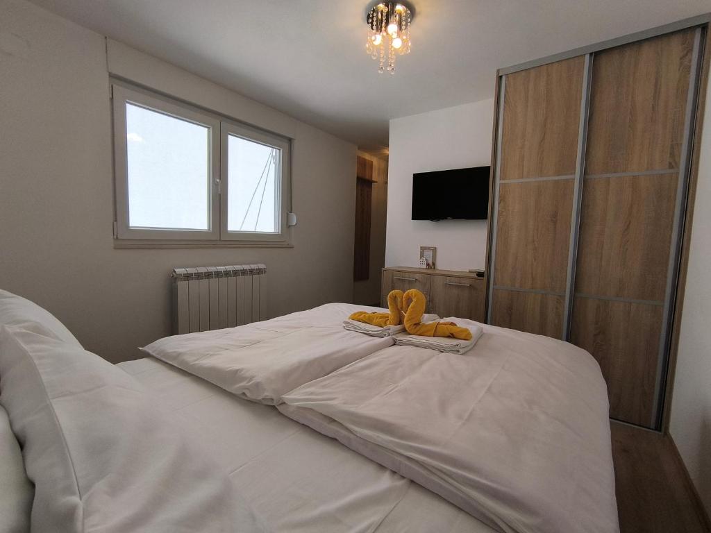 Postel nebo postele na pokoji v ubytování Apartman Vukalović