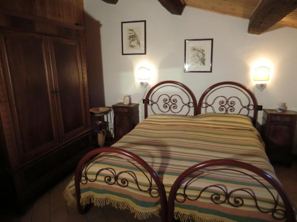 Łóżko lub łóżka w pokoju w obiekcie Agriturismo Ca'de'Gatti