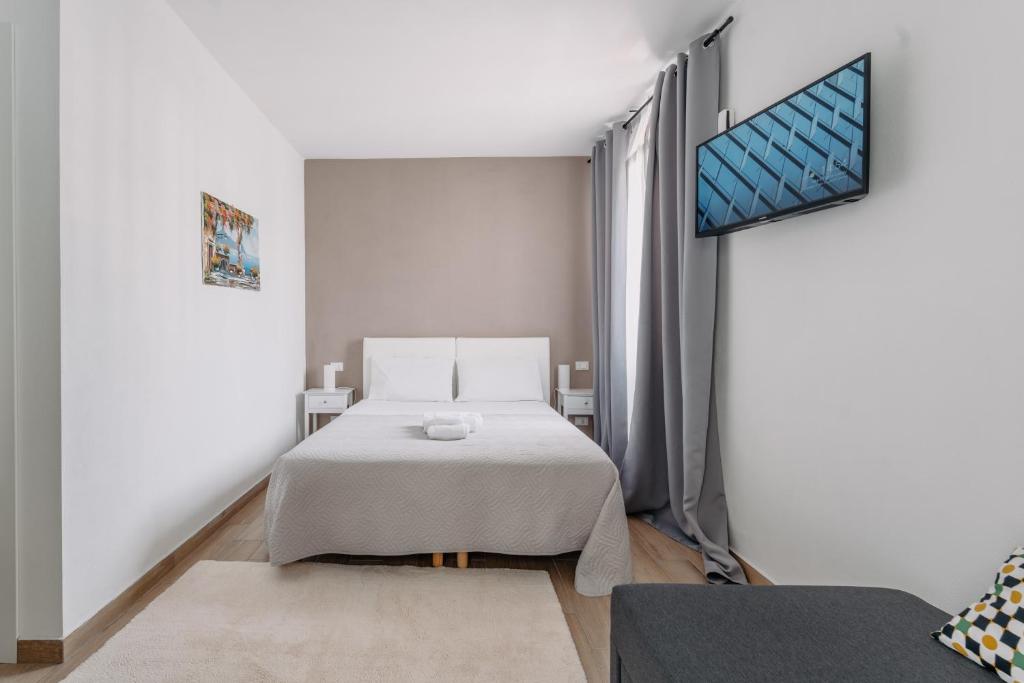 Postel nebo postele na pokoji v ubytování Franciacorta Rooms 1