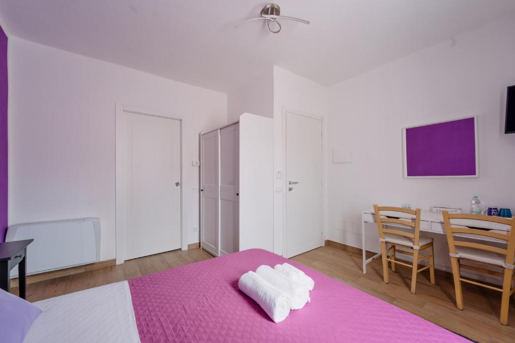 Postel nebo postele na pokoji v ubytování Franciacorta Rooms 1