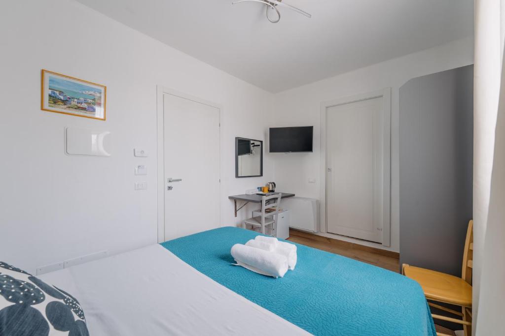 Postel nebo postele na pokoji v ubytování Franciacorta Rooms 1
