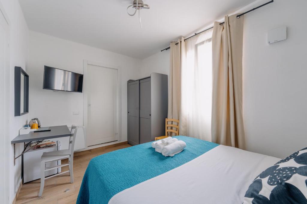 Postel nebo postele na pokoji v ubytování Franciacorta Rooms 1