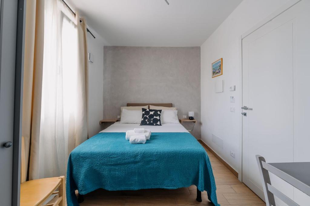 Postel nebo postele na pokoji v ubytování Franciacorta Rooms 1