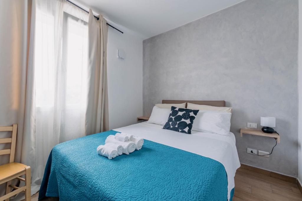 Postel nebo postele na pokoji v ubytování Franciacorta Rooms 1