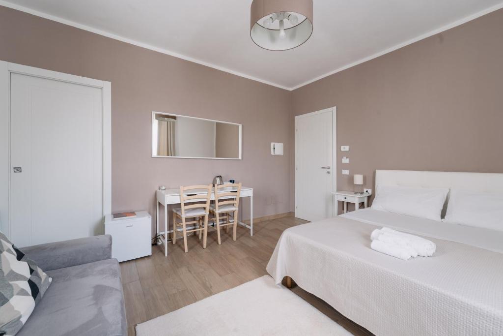 Postel nebo postele na pokoji v ubytování Franciacorta Rooms 1