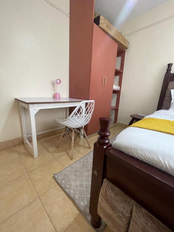 Postel nebo postele na pokoji v ubytování Cosy Homes Eldoret