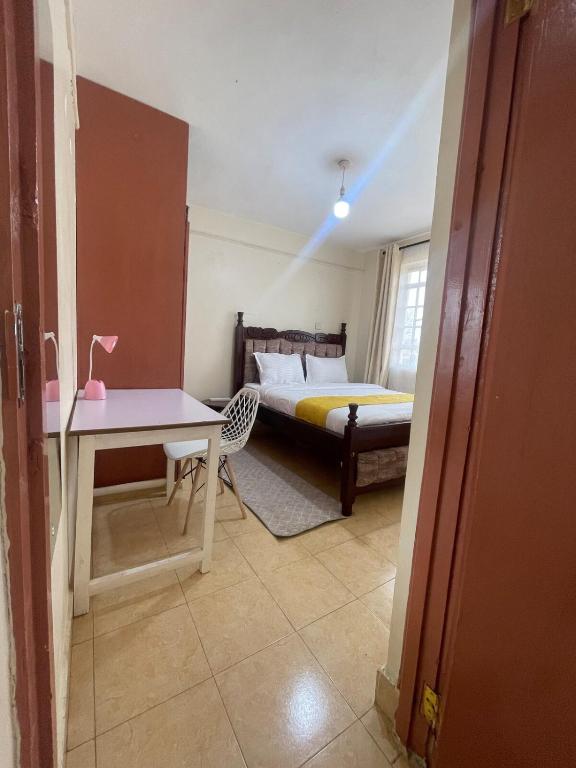 Postel nebo postele na pokoji v ubytování Cosy Homes Eldoret